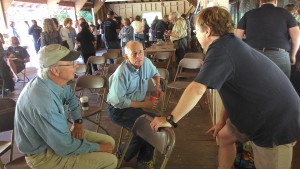 Hal Cohen, center, and Matt Soper, right, discuss the Float the Boat campaign.