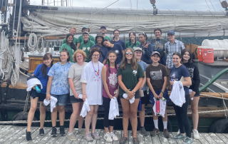Group photo of the 2022 Young Women at the Helm participants and the Clearwater crew